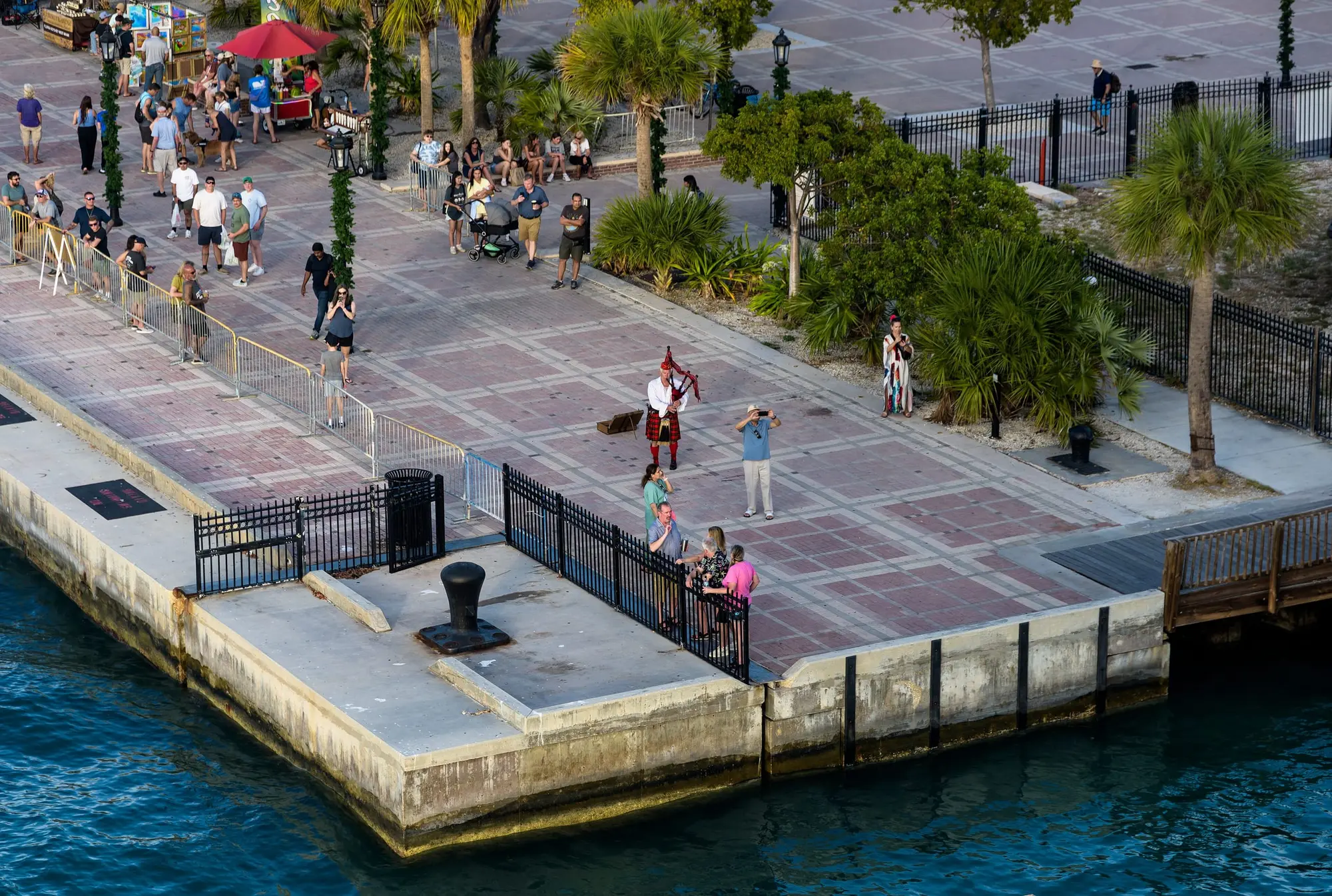 The south corner of Mallory Square on the Key West waterfront, with a bagpiper playing