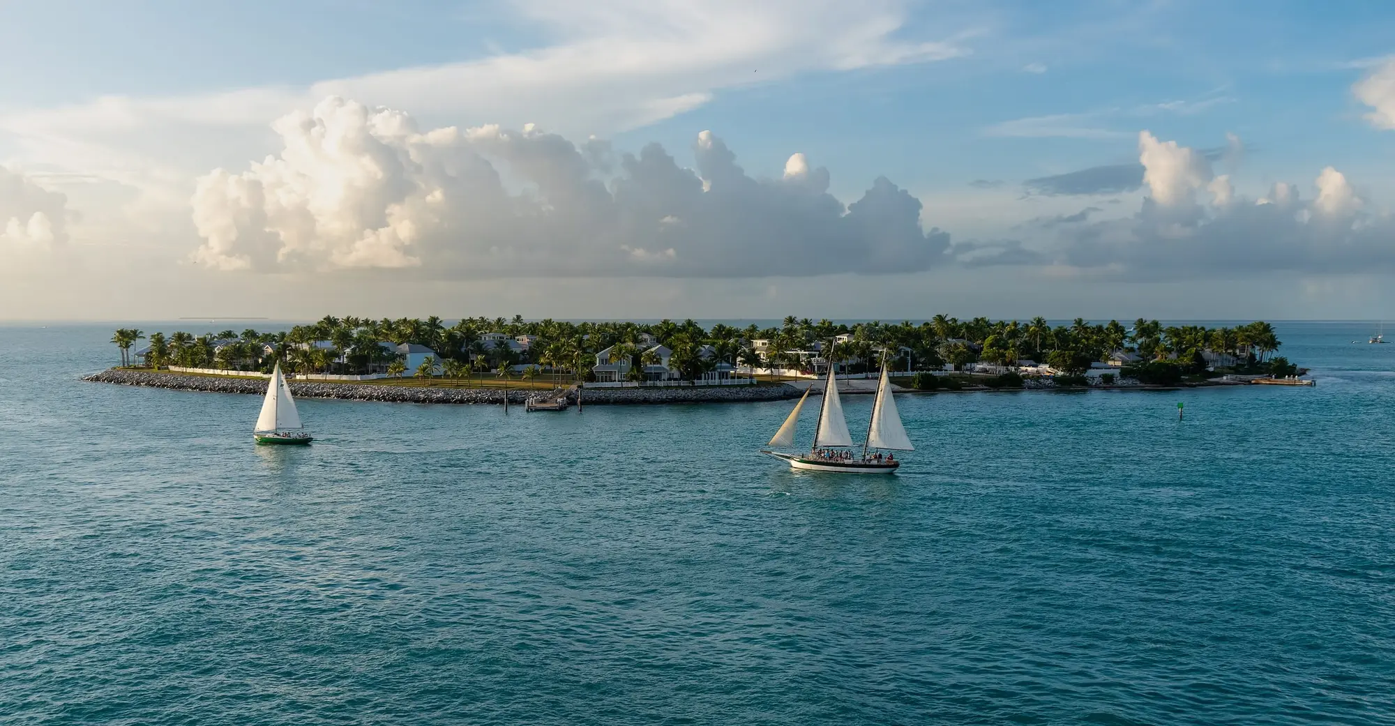 Sailboats in the harbor off Key West, with Sunset Key behind